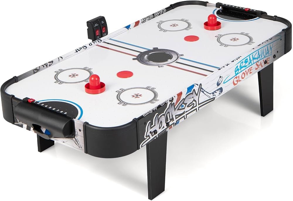 Air hockey table and 12-volt blower motor replacement on a light floor