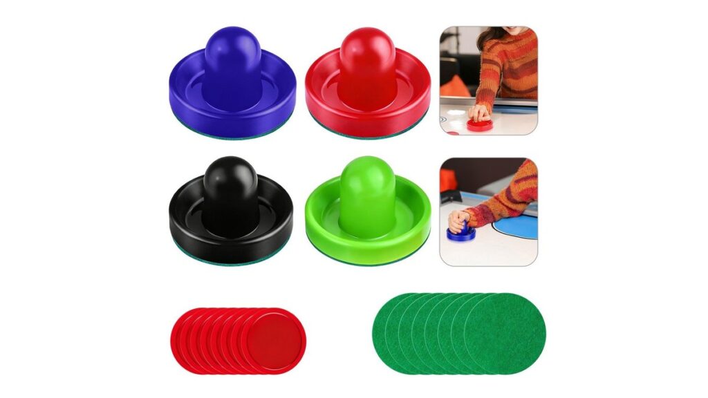 A professional air hockey paddle with a new felt sticker on a table.