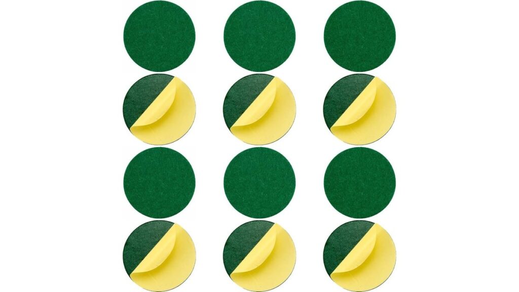 Self-adhesive felt pad pressed onto the base of an air hockey mallet